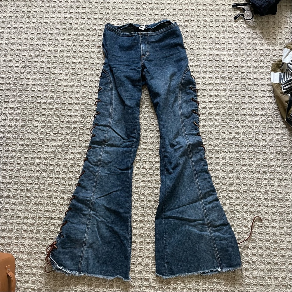 Frankie B. flared jeans with lace-up corset detail